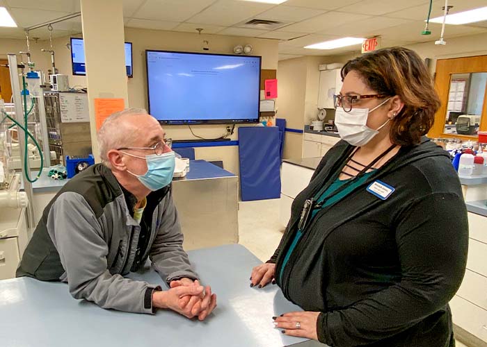 Veterinary Social Worker talking with adoctor